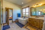 Large soaking tub right when you walk into the master bathroom